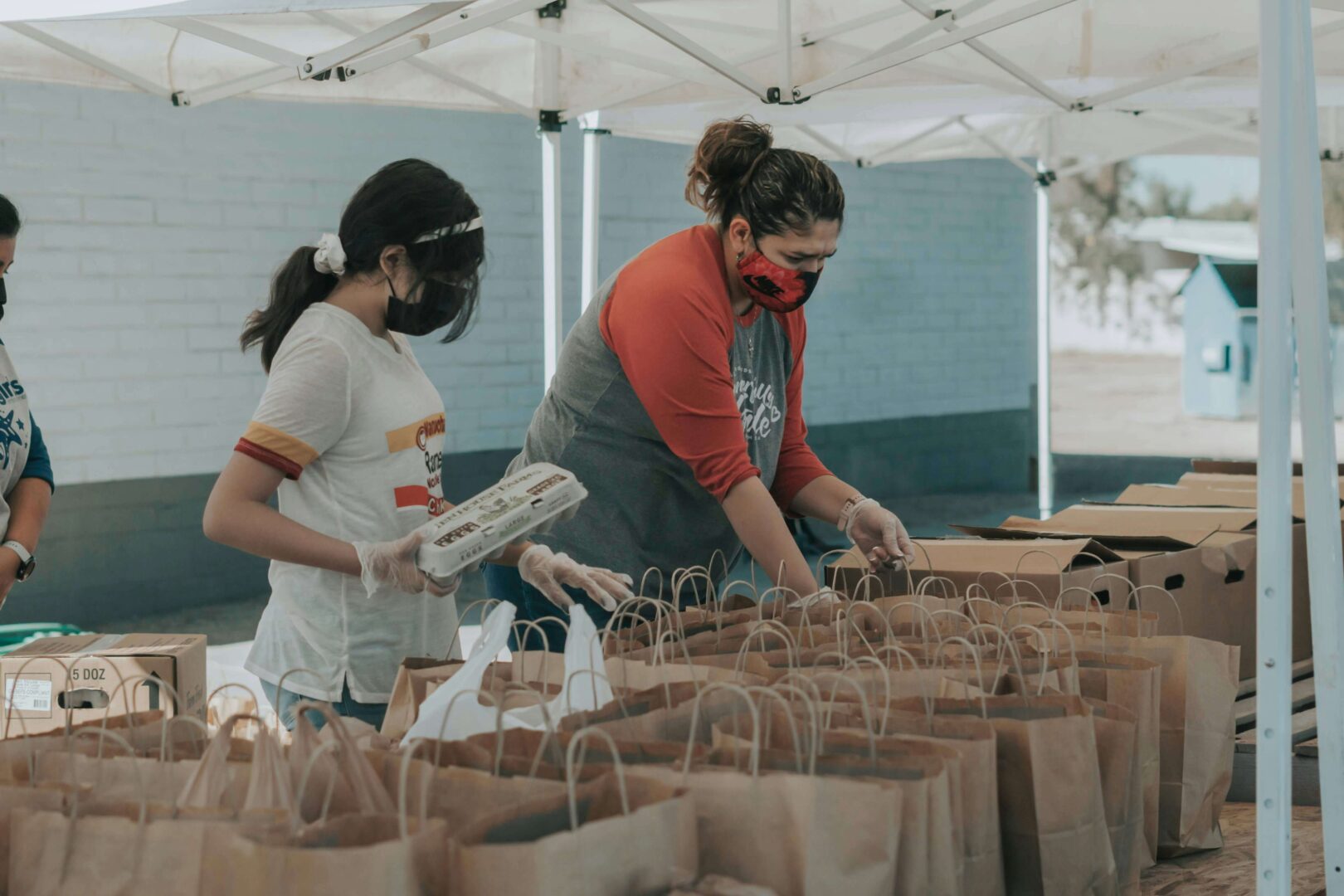 Volunteers preparing donation bags